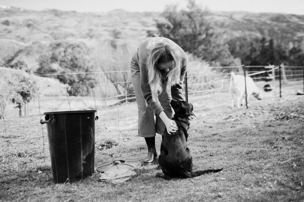 Black and white image of woman with dog