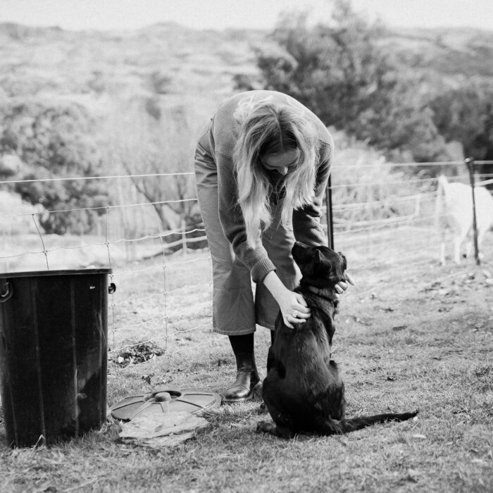 Black and white image of woman with dog