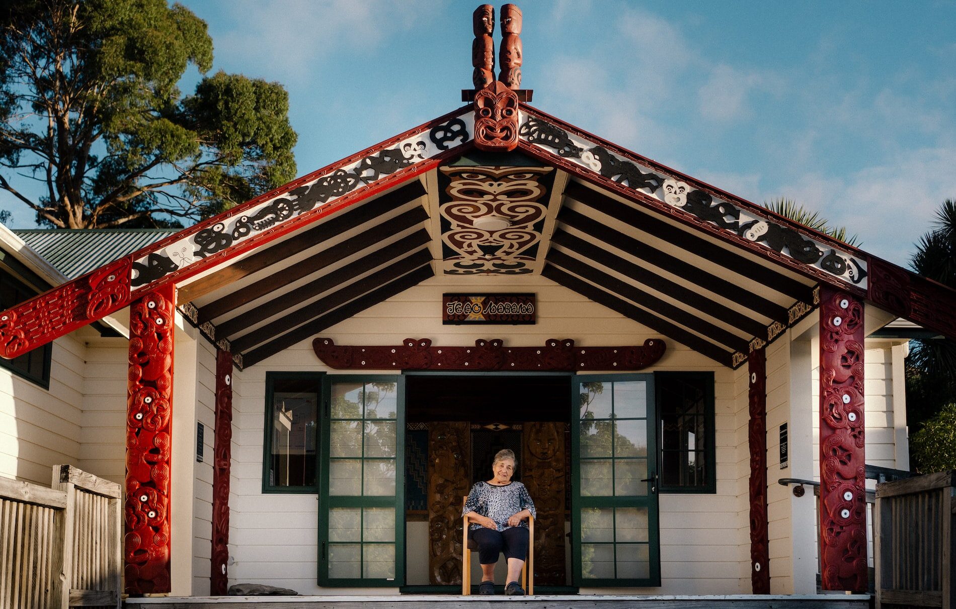 Mairangi sits in front of her marae, Onetahua.