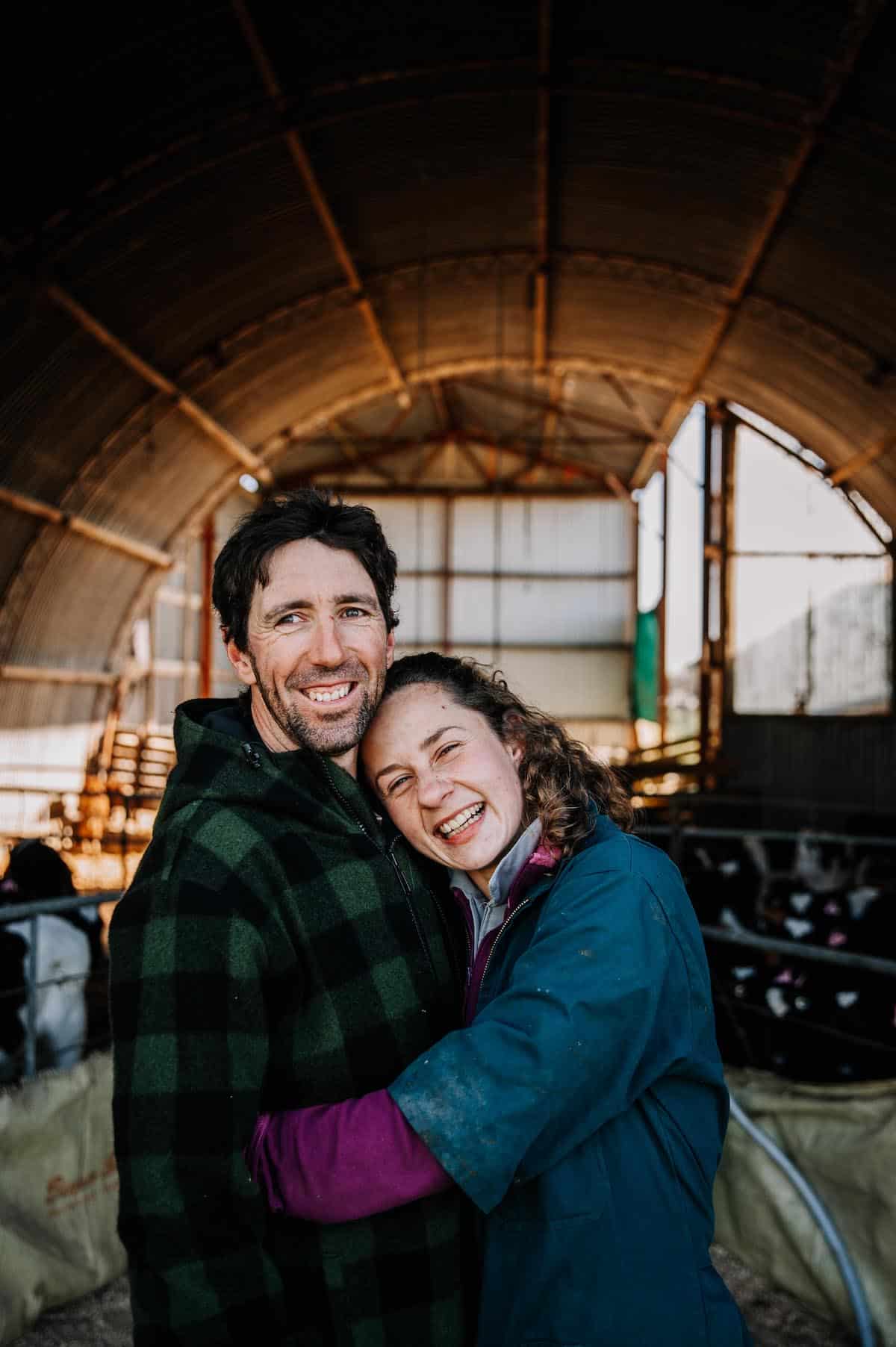 Woman and man happily hugging.