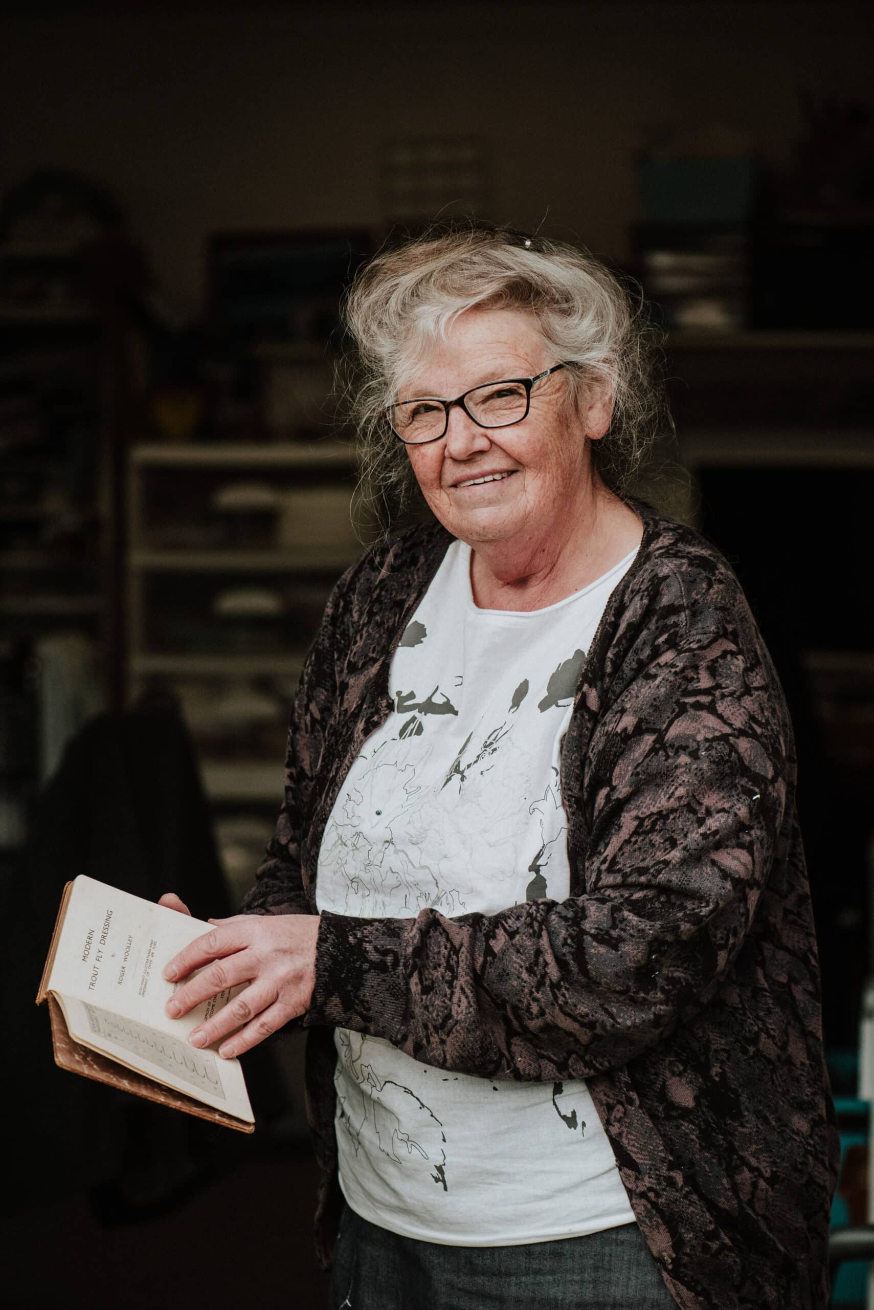 Bronwyn with her copy of Modern Trout Fly Dressing by Roger Woolley, published in 1932