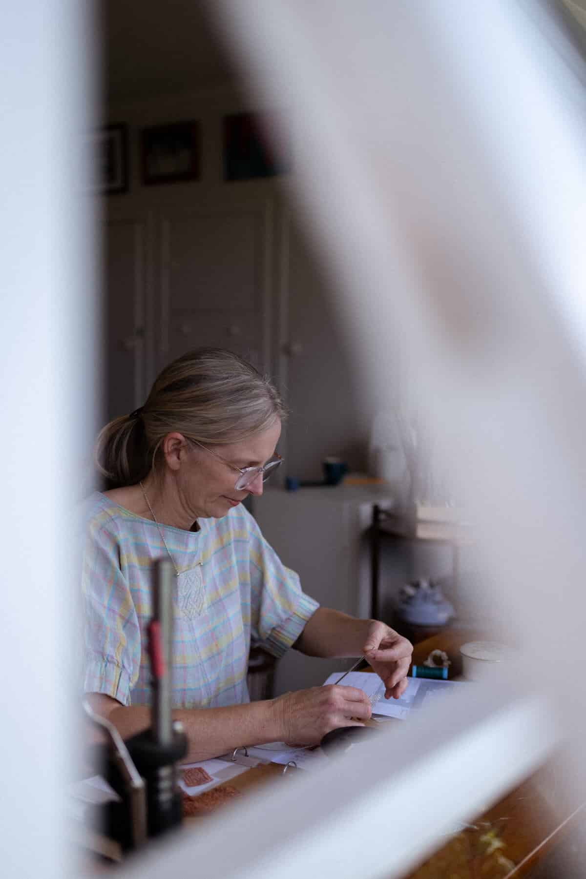Woman creating knitting pattern