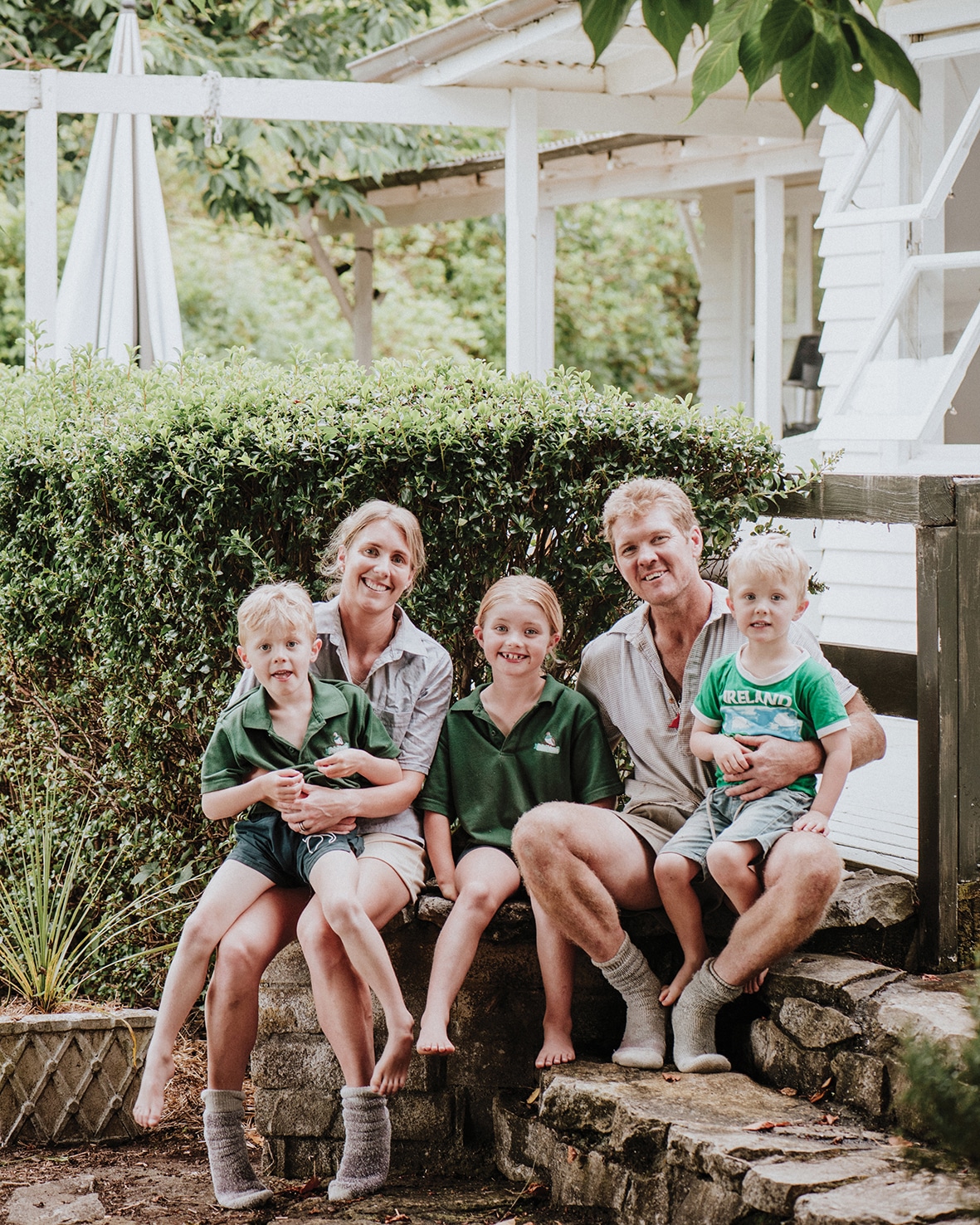 Above: Emily with her husband, Harry, and their children, Ted, 6, Pippa, 8, and Arlo, 4. “Growing up, we were lucky that we
could play lots of sports in our backyard – hockey, cricket, rugby, tennis," Emily says. "Playing outside with my siblings
really shaped my childhood, love for sport, and made me quite competitive, as I always wanted to beat the boys.”