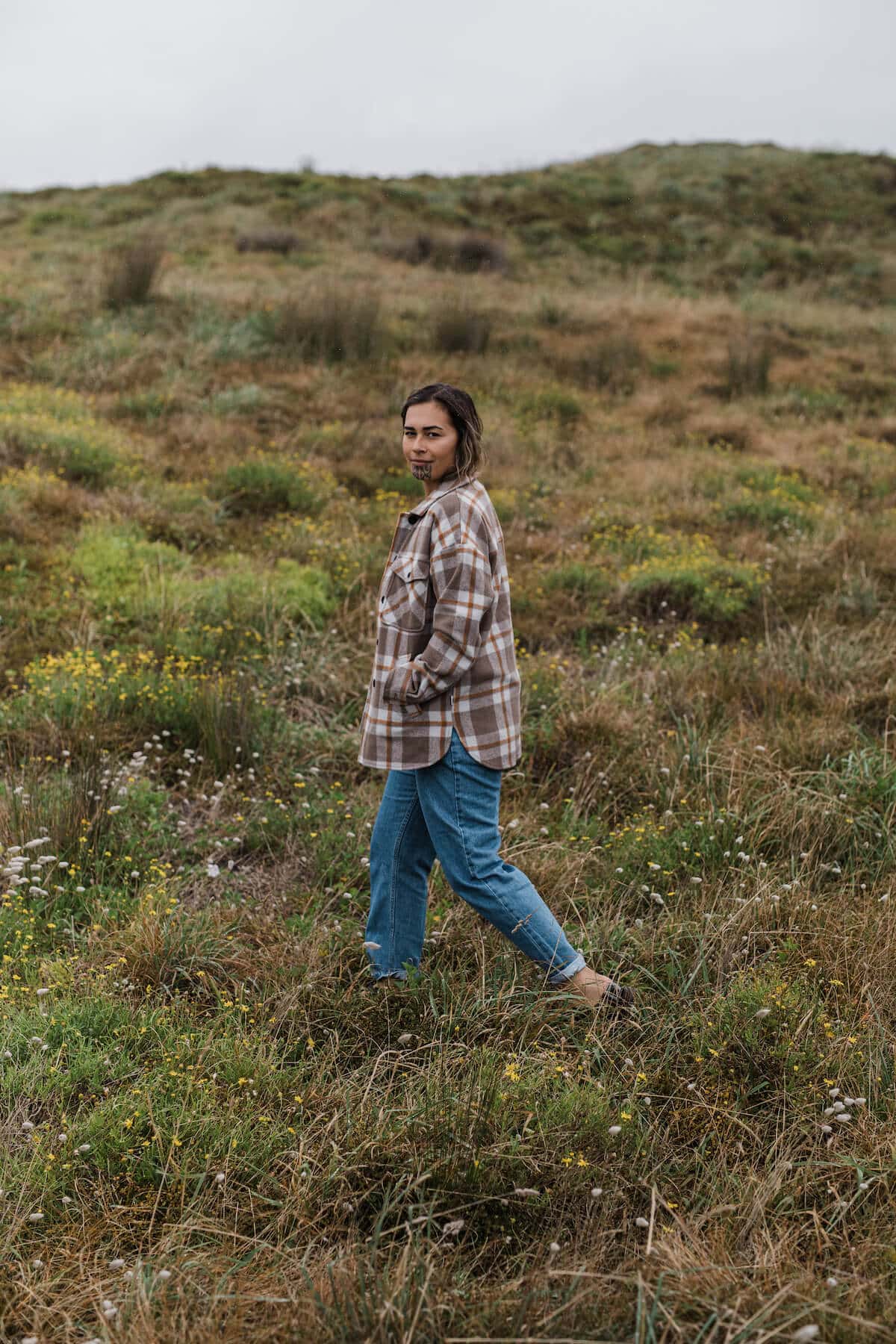 Arpége in the Anchorage Wool Shirt Jacket in Cashel Street Check, $299.99, and her own denim.