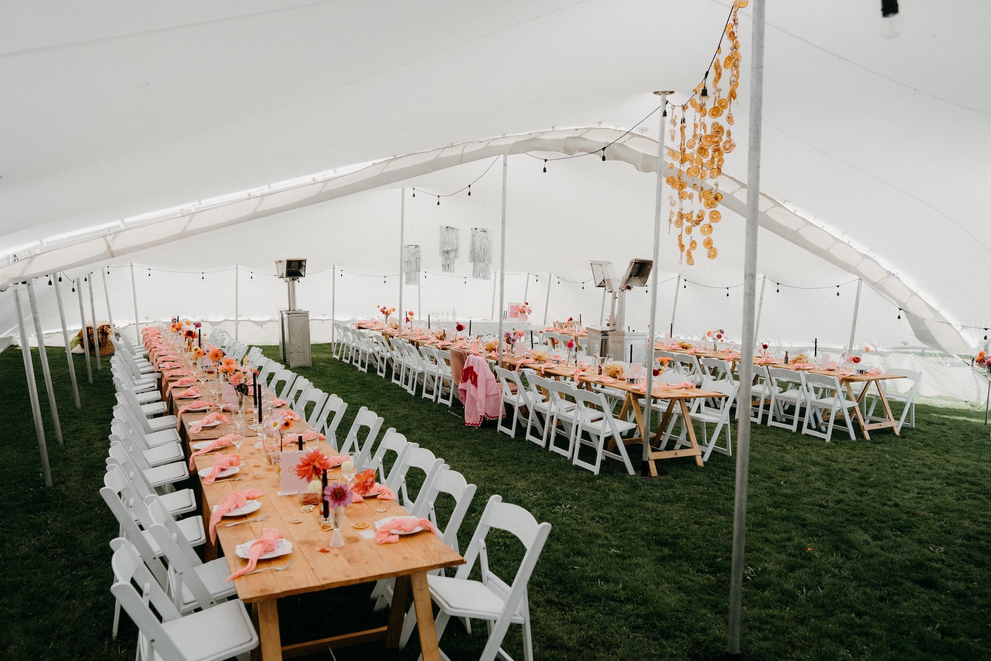 Pink and orange table decorations at the wedding marquee in Aparima Riverton