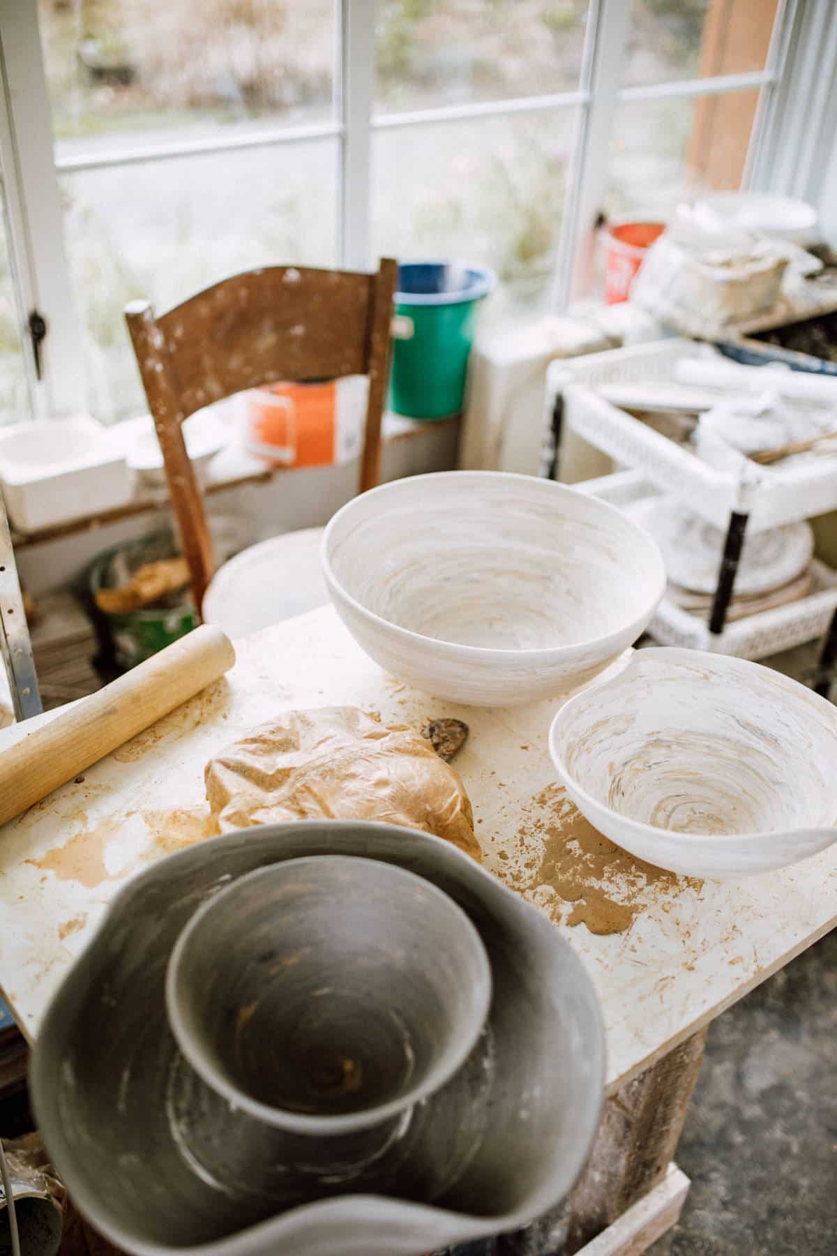 A table with ceramic works in process