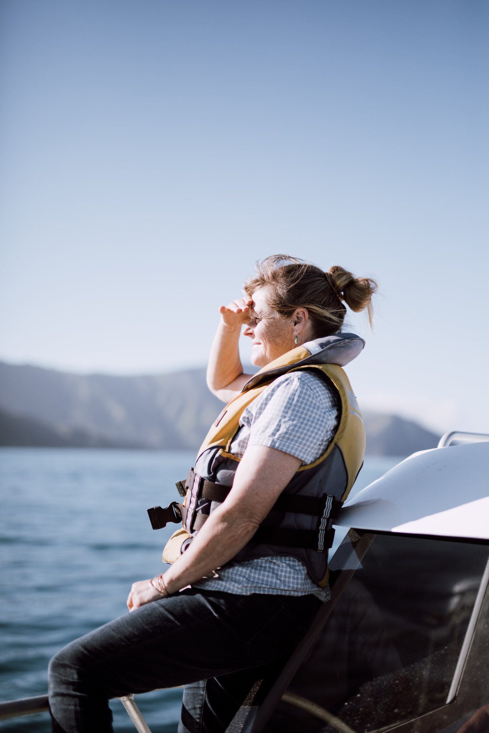 Kristen sitting on a boat