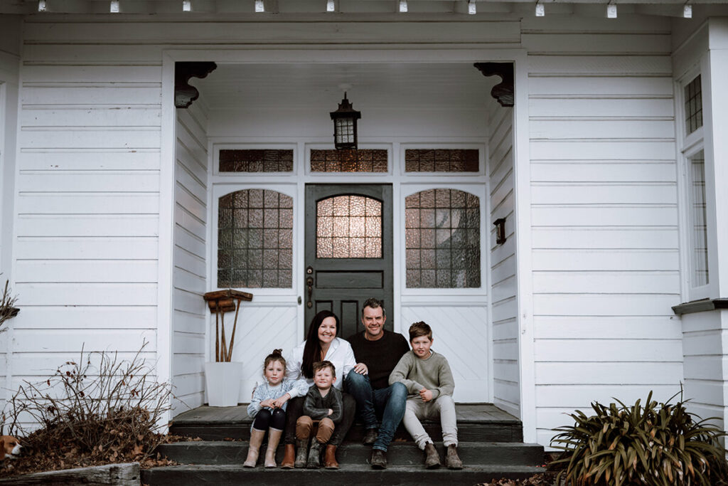 The Hayes family in front of their home