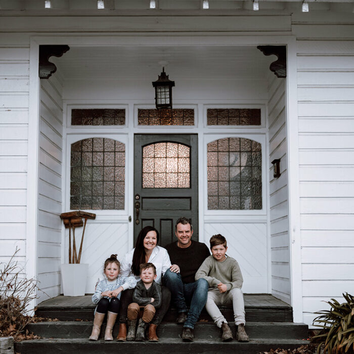 The Hayes family in front of their home