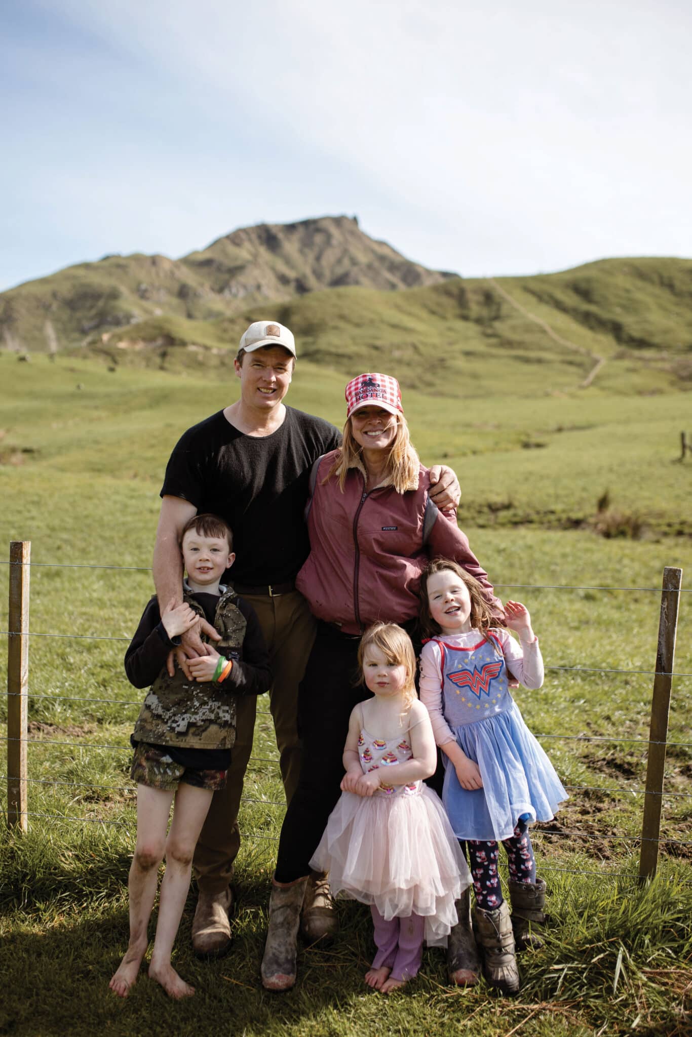 Above. Ants and Jenny with Darcy, Grace
and Ada. “I read or heard somewhere that the farm will take
all of your time and all of your money if you give it – like it is
just a bottomless pit. You could give it all your time and your
money – it would still never be enough for the farm,” Jenny
says. “So it’s just finding that balance of prioritising each other.
I think we just work because we are a little bit opposites, and
humour works for us, and our kids bond us together as well.”