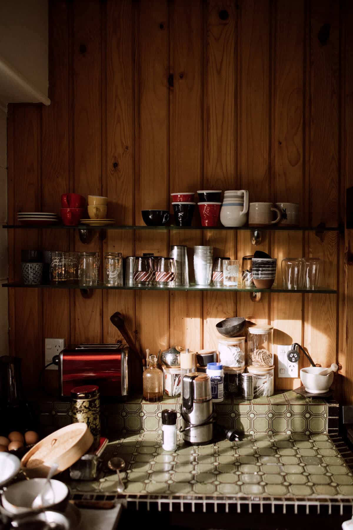 Philippa’s collection of mugs and glasses in her sun-drenched kitchen.