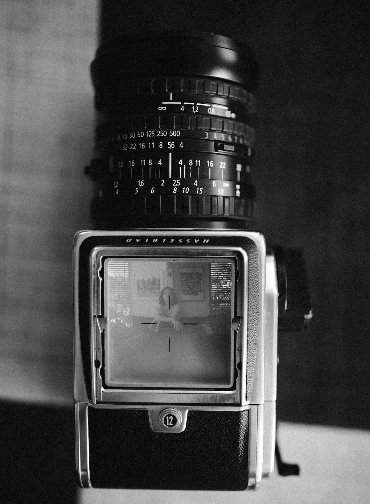 Black and white image of an old film camera