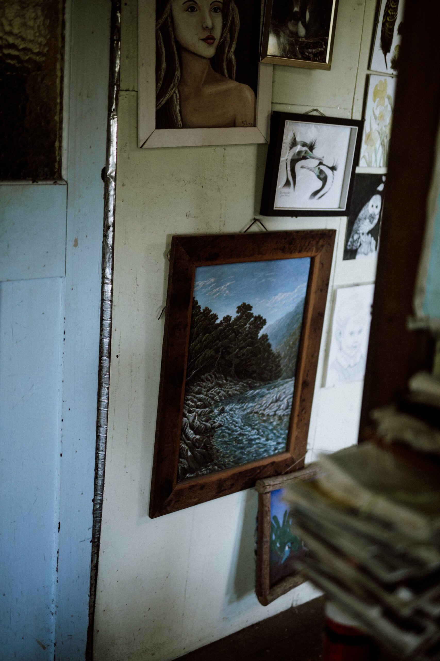 The living room is filled with books and artwork. "We had a pet chicken that happily sat in Robin's pack while we walked to Haast," Catherine says, showing me five colourful, hand-bound booklets. Inside, there are printed photos of Chooky the chicken. "I wrote stories about the chicken and its adventures. I would read them to the kids as bedtime stories. All the best memories I have are the ones that involve the kids."