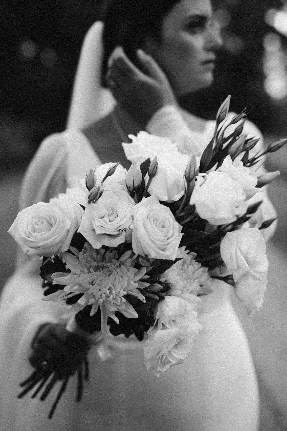 Black and white close-up image of a bride's bouquet
