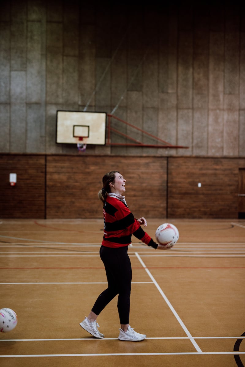 Jodi King, who's on the Mossburn netball team, laughs during practice.