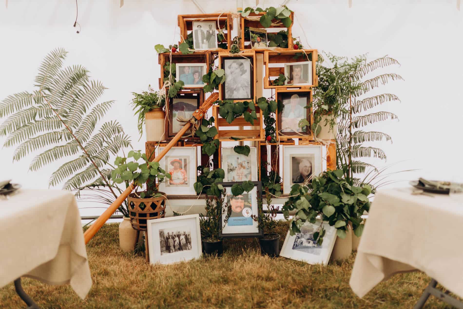 A display of photographs, acknowledging whānau who have passed