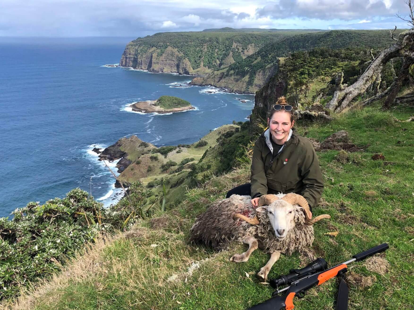 Woman with the wild ram she has shot.