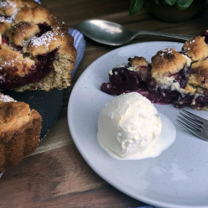 Black doris plum pie with a scoop of icecream