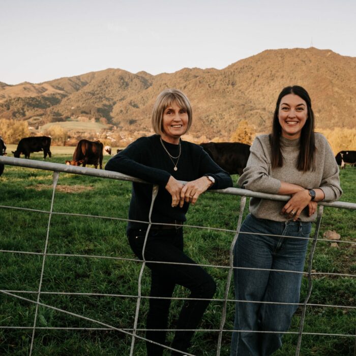 Robyn and Jana on a farm gate