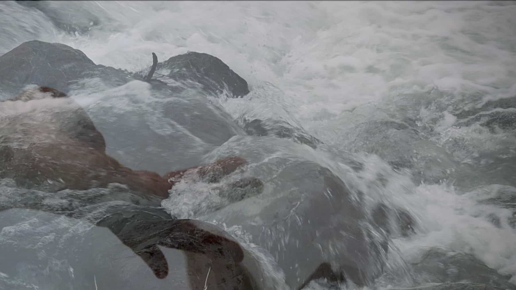 Digital still image of rocks and water, part of an art exhibition