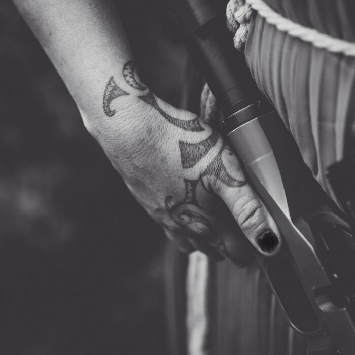 Pania Marsh's hand holding a gun
