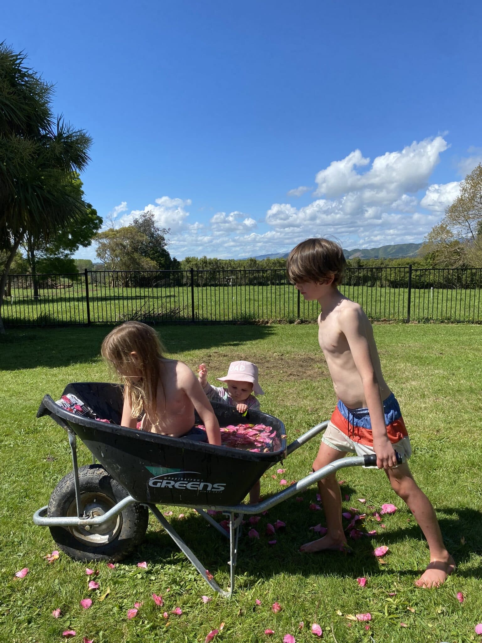 Above: The kids finding any way to cool down on a warm day.