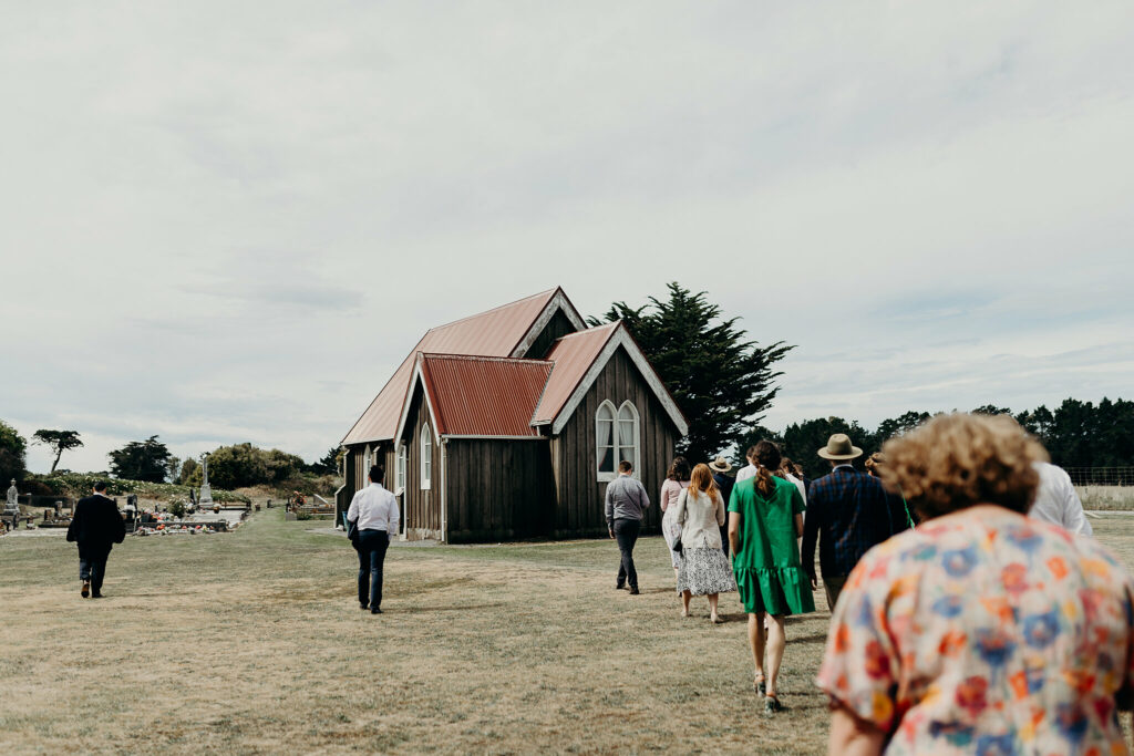 People walking towards a building