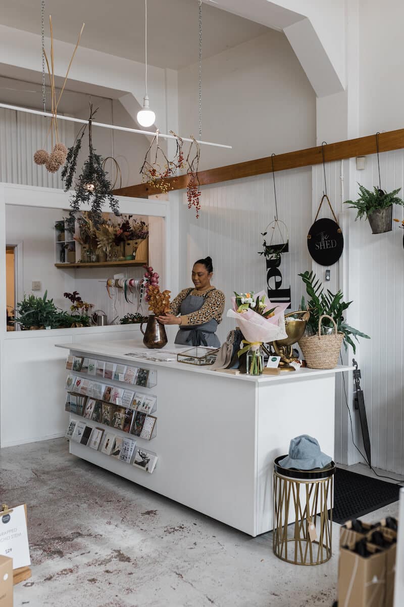 inside a shop with beautiful gifting items, homewares and florals.