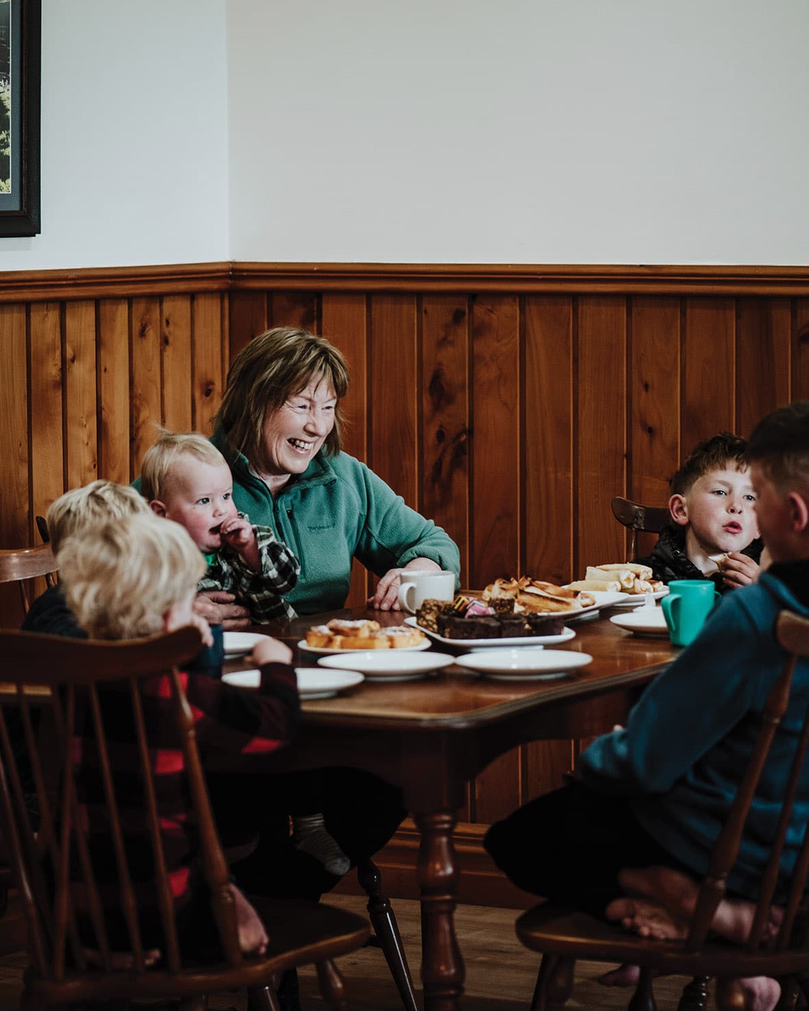 Rosie with some of her grandchildren. Carter, 10, Hudson, 8, Arjay, 5, Payten, 4, Flynn, 3, Hunter, 2, and Henry, 1, enjoy playing together at their grandparents’ house, which is a focal point for family gatherings. “It wasn’t hard to wrangle them all together for a photo – I just offered them lunch.” 