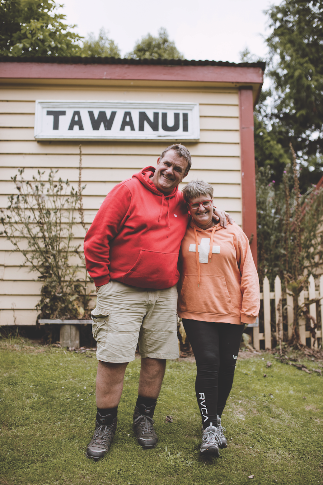Lyndon and Gill standing outsite Caitlins Mohua Park Eco Accommodation