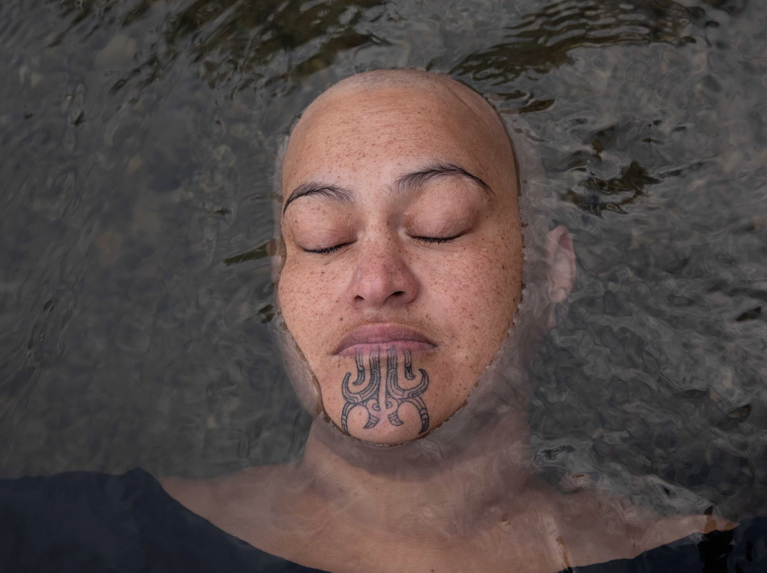 <strong>Darling. </strong>"Darling is part of the Ko au te awa, te awa ko au series - I am the river, the river is me. She's a mother of seven tamariki. That day was really special. She started off with all her aunties dressing her up in korowai with feathers in her hair and all that, and after about five minutes she goes, 'Aunties! I'm not wearing any of this, I don't want to wear it. This is not where I'm at now,' and flung it all off. I said, 'Darling, why don't we go for our own little walk?' So the aunties went off and we just spent the day at her awa, Tarawera River. She's had a tough road telling her cancer to f--- off and she is on a strong road of recovery. She's reconnecting - she talks a lot about her wairua and her tūpuna, that connection and how she feels when she's in that river. Every now and then when you're shooting you know something really incredible is happening. For whatever reason, these elements all just come together, and these moments are just really magical. This moment with Darling was one of them. We both just fell into this zone where nothing was directed, and it all just happened."
