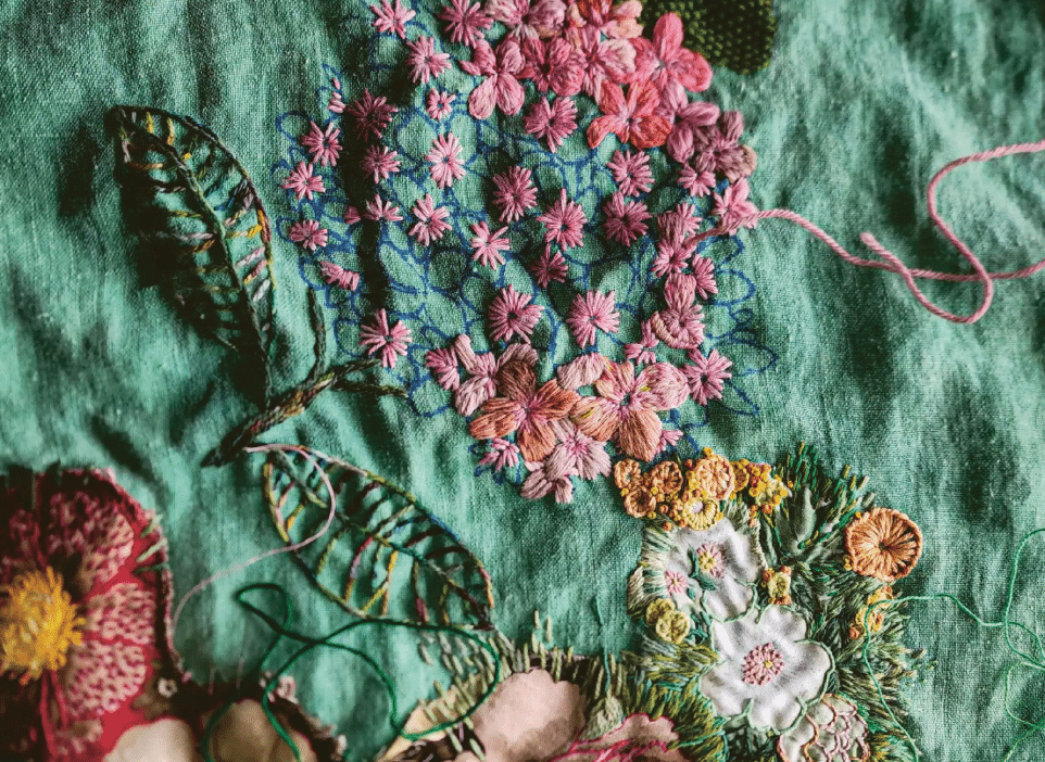 Progress shot of Garden Wanderings, 2022, with a hydrangea as big as both hands. The finished work measured eighty centimetres high by one hundred centimetres wide. Fleur says, “I always have more than one piece on the go. Whenever I get bored, annoyed or lost, I can put that work down and start working on another piece. This ensures I bring a sense of enjoyment to all of my work and has become an excellent way to avoid overworking or losing my sense of direction. Most importantly it prioritises joy in the process.”