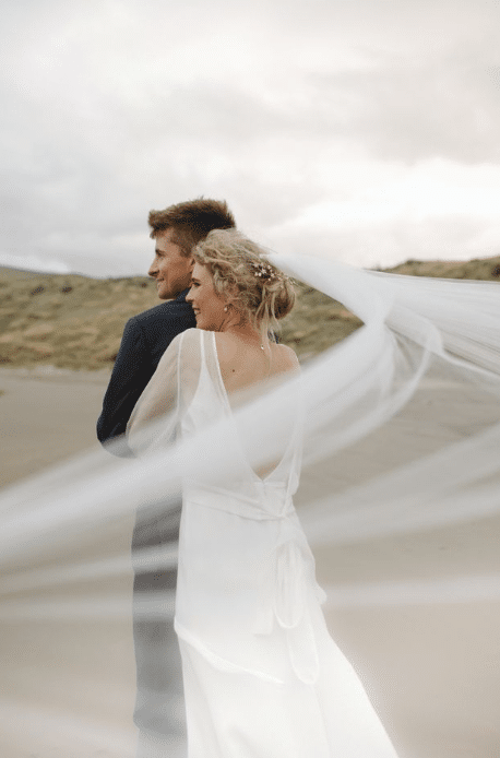 Above. The wild Wairārapa wind caused a few funny moments during the ceremony. “Once I got to George, the wind blew my veil completely off – it landed on the videographer’s camera. Thank goodness it blew that way and not off the cliff!