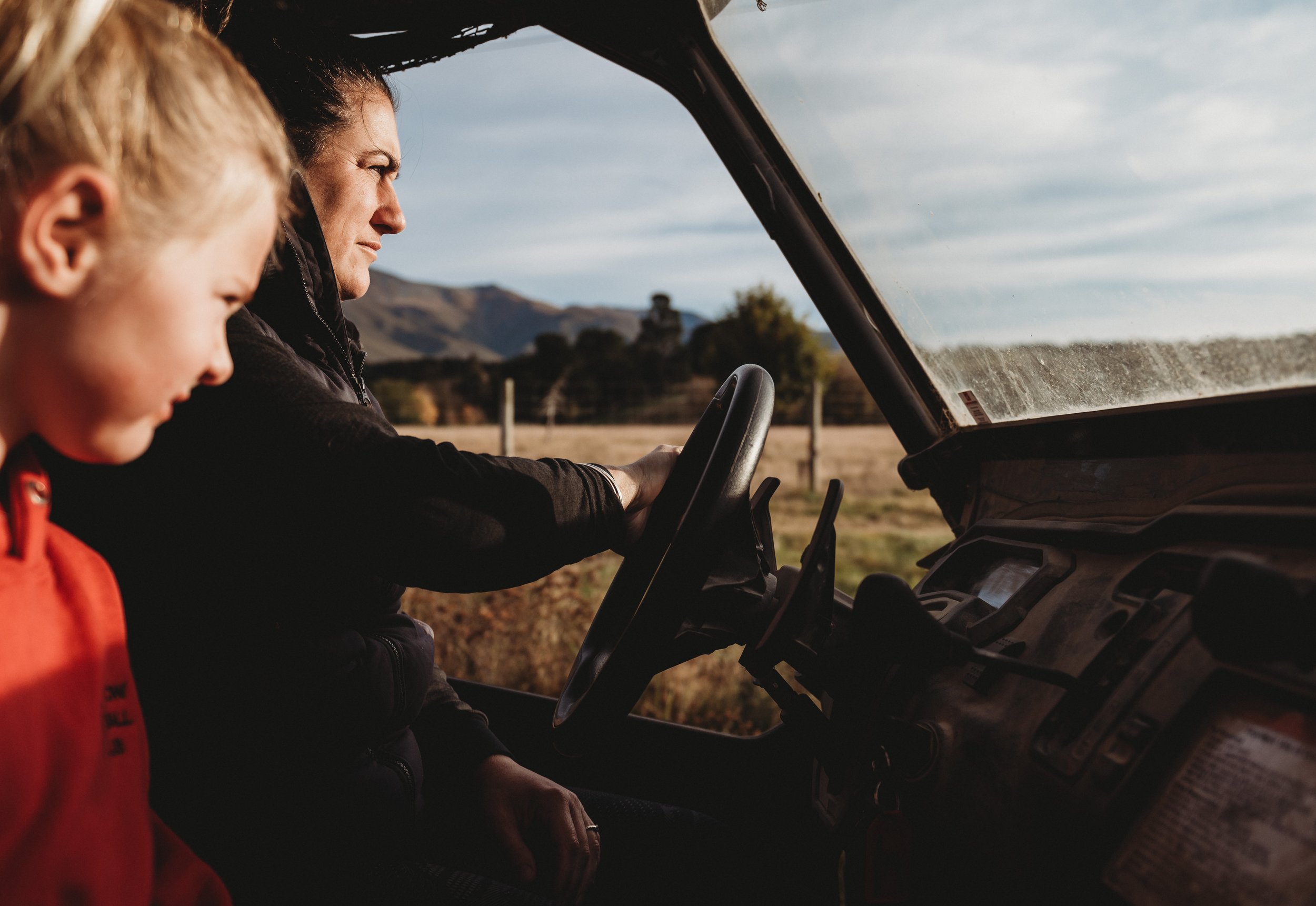 Juliet in the driver's seat of the side by side. Being a mum of three is a hands-on job, and is one she handles with confidence and compassion.