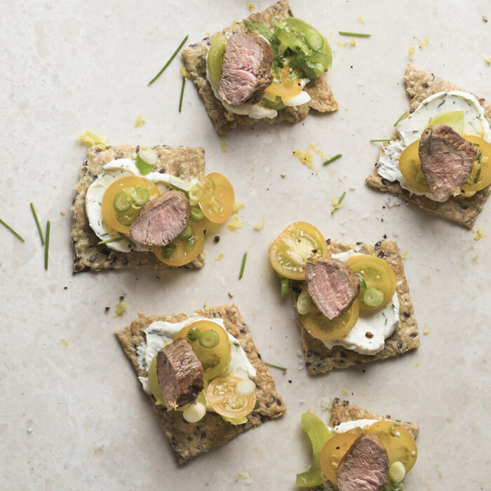 Lamb and tomatos on crackers