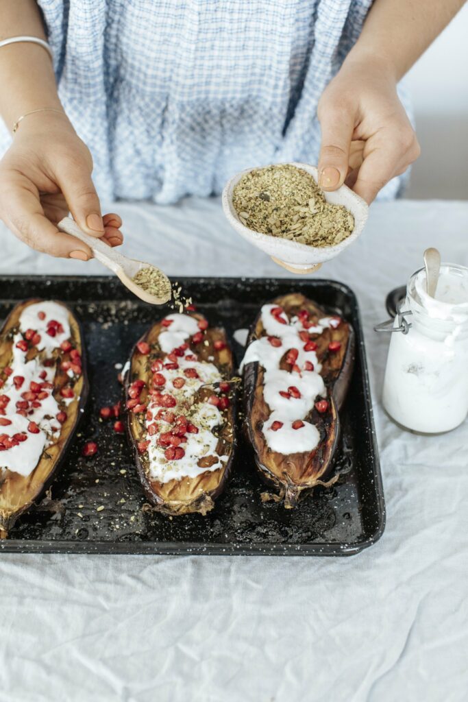 Thyme and Pomegranate Baked Eggplants with Lemon Yoghurt
