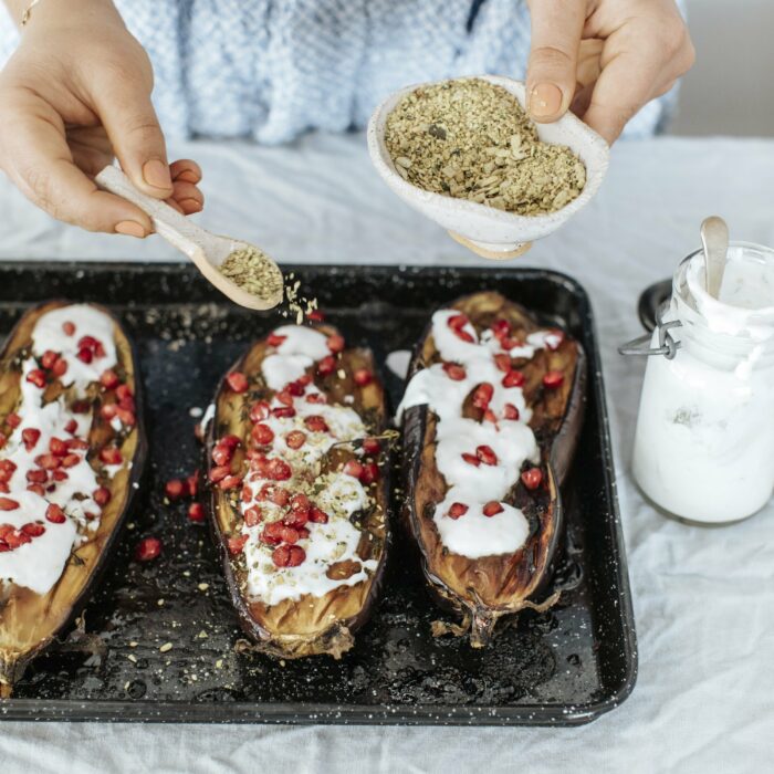 Thyme and Pomegranate Baked Eggplants with Lemon Yoghurt