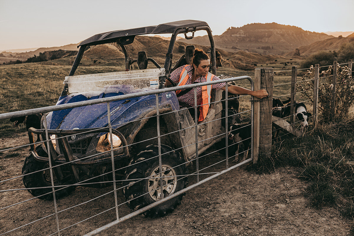 Anita endrick in a tractor behind a gate