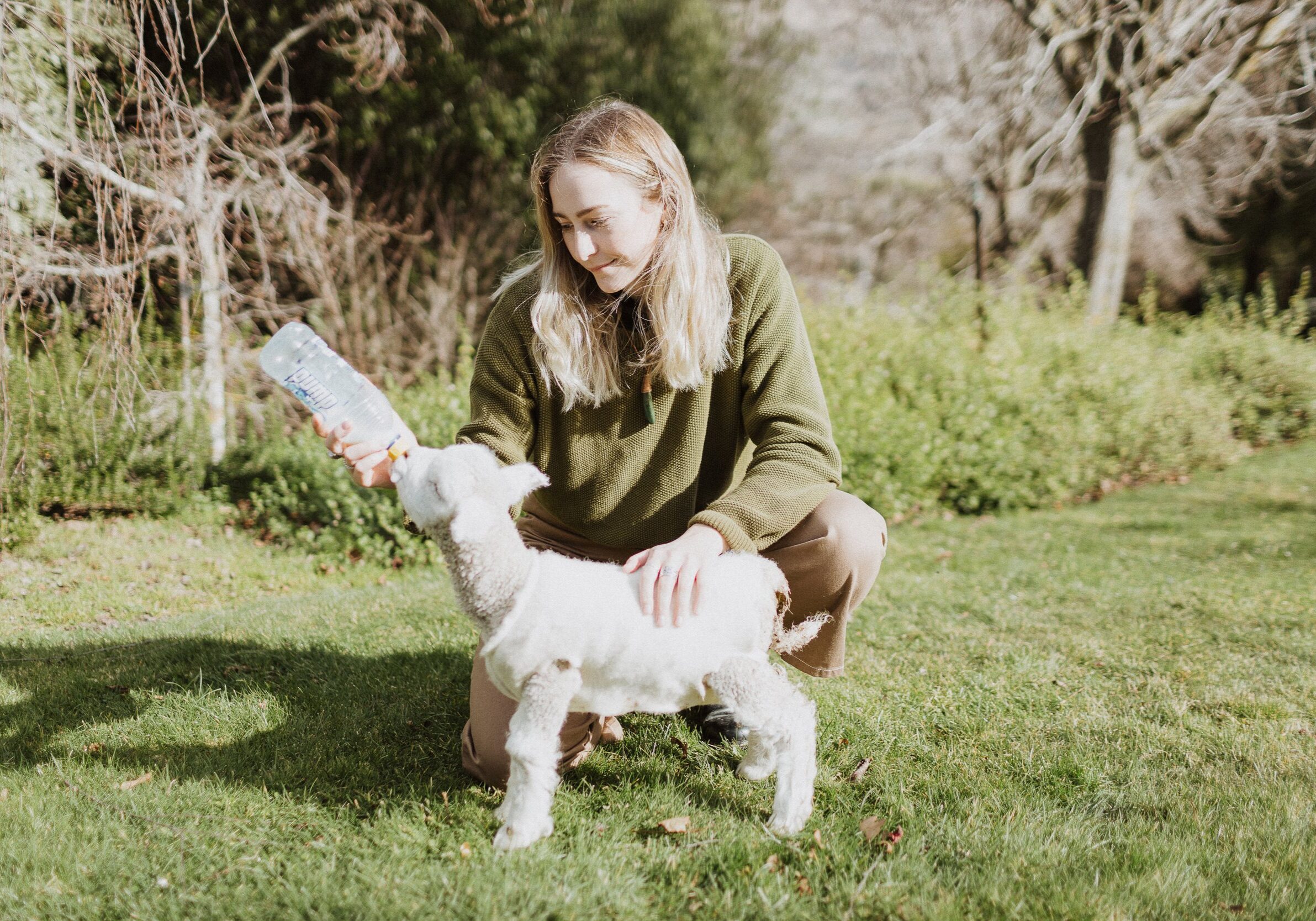 Zoe feeding a lamb