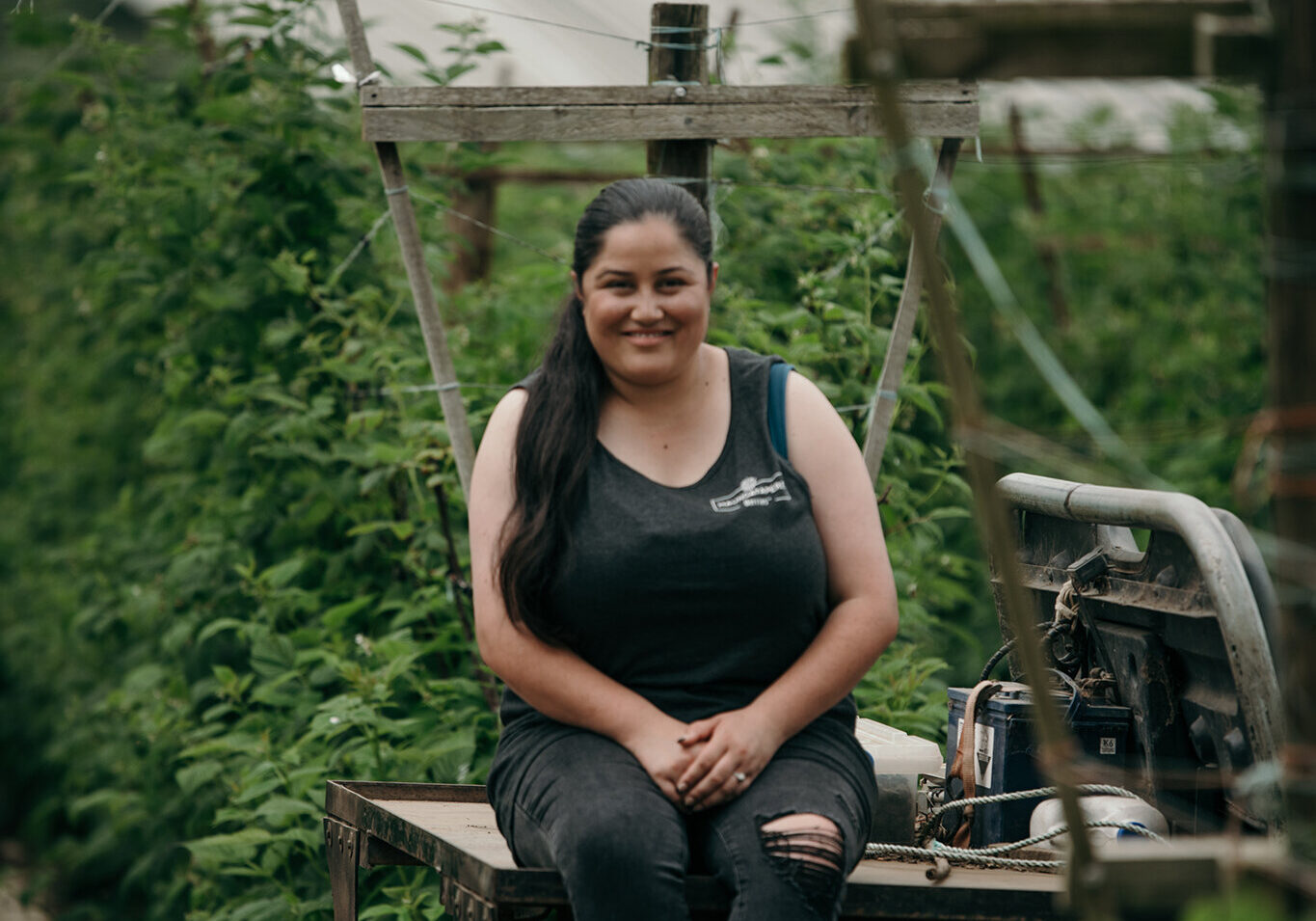 Finnisha sits in front of plants