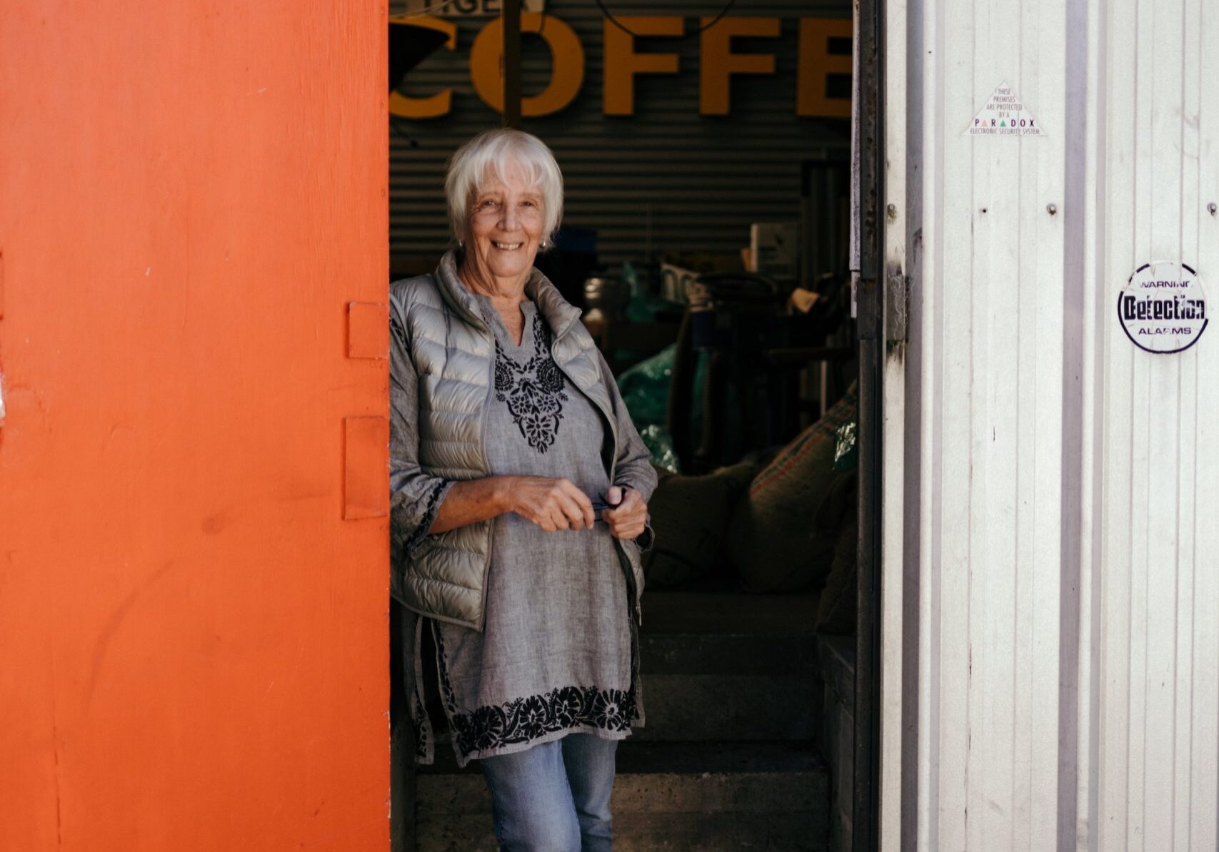 Anne in the doorway of Tiger Coffee