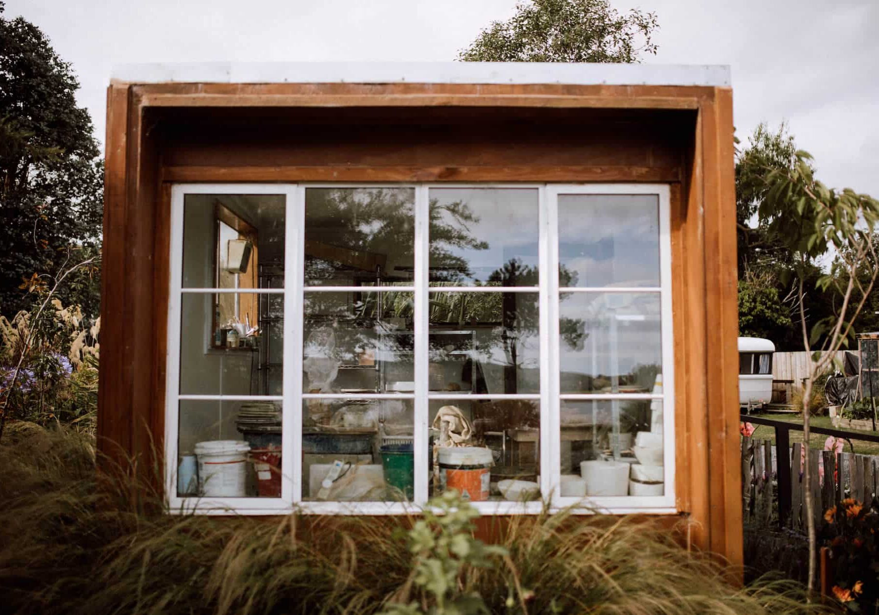 Little timber art studio with a full wall of glazing