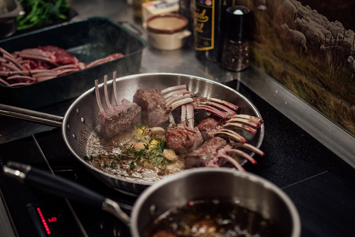 Lamb ribs cooking in a frypan