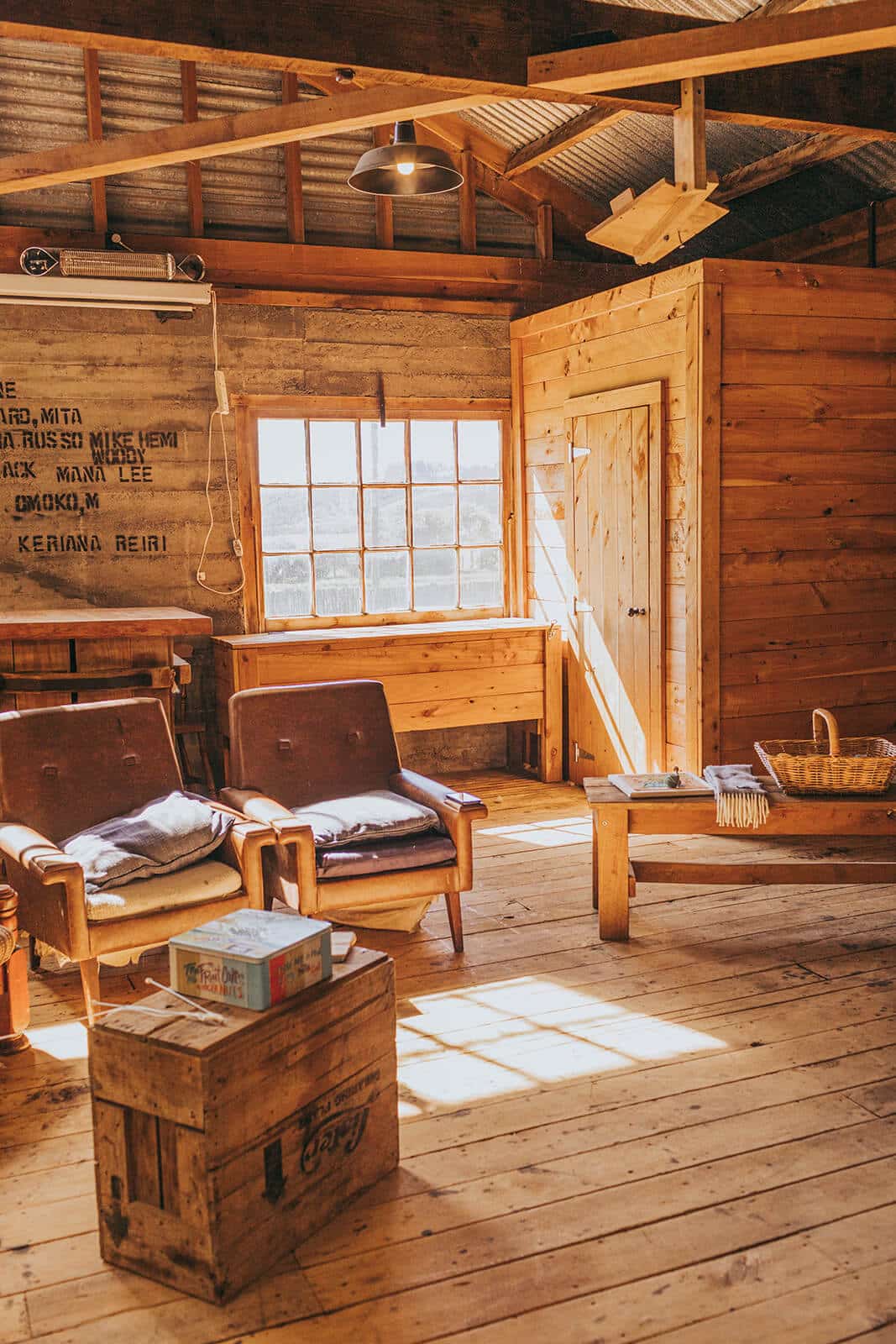 Empty chairs in the sun in the woolshed