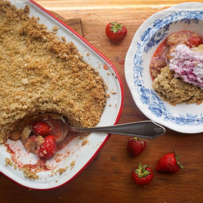 Rhubarb and berry crumble served in an enamel dish.